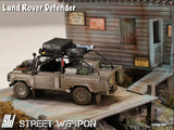 Land Rover Defender *Tomb Raider* Muddy - Street Weapon - 1:64 Modellauto 1/64