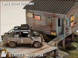 Land Rover Defender *Tomb Raider* Muddy - Street Weapon - 1:64 Modellauto 1/64
