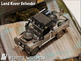 Land Rover Defender *Tomb Raider* Muddy - Street Weapon - 1:64 Modellauto 1/64
